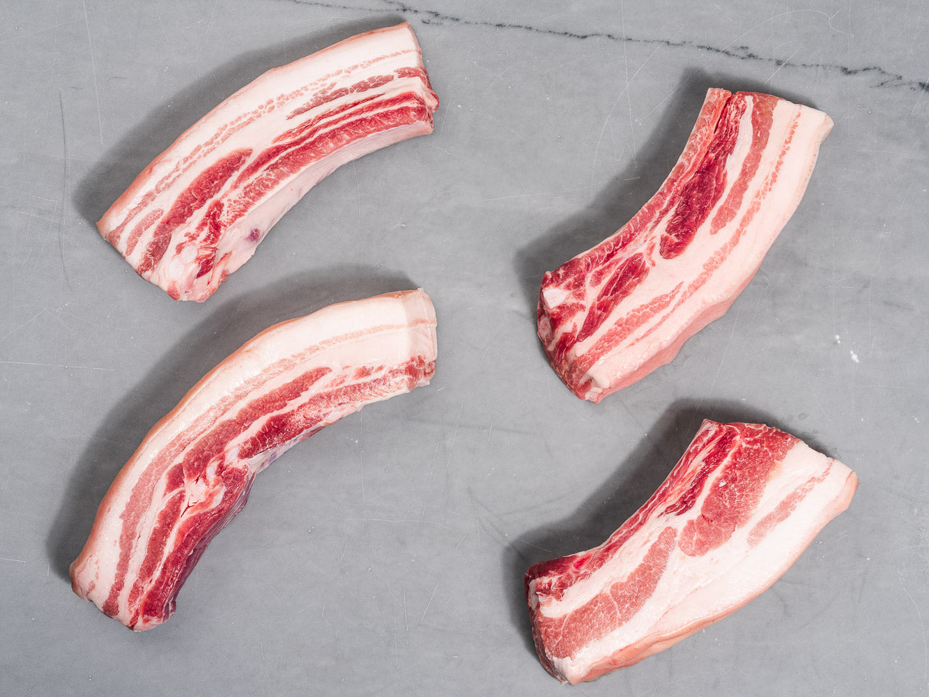Bone In Skin On Pork Belly Chops