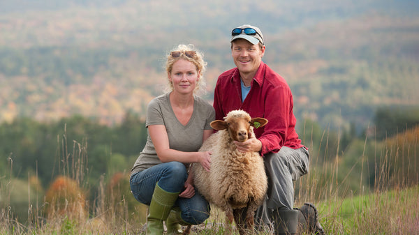 Ben and Grace Machin of Tamarack Sheep Farm with a Tunis Lamb