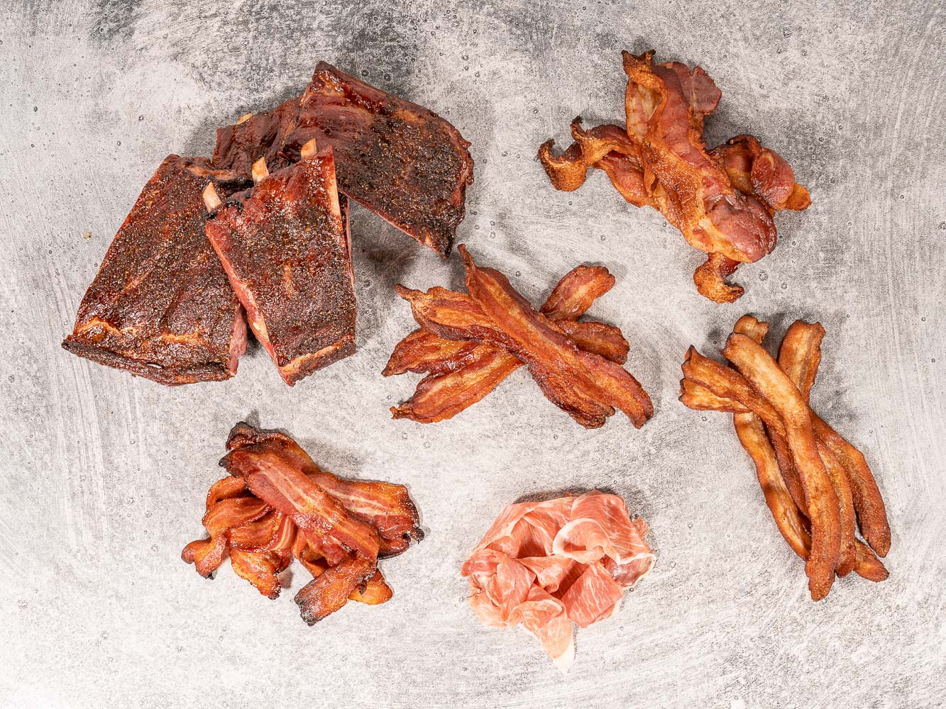 A selection of meats smoked traditionally over hard wood | Heritage Foods
