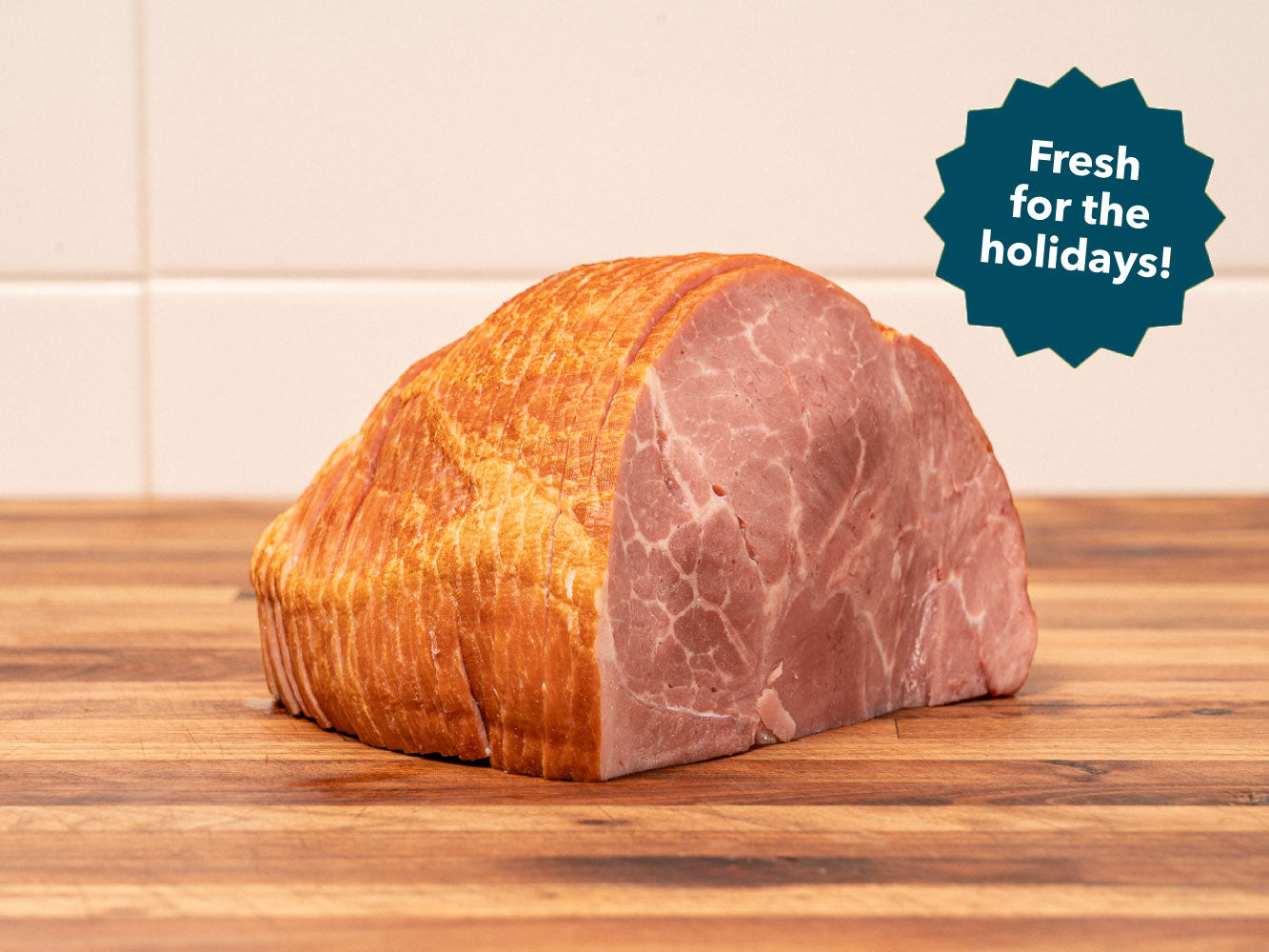 FRESH SPIRAL SLICED BONELESS 1/4 HERITAGE MAPLE SUGAR CURED HAM