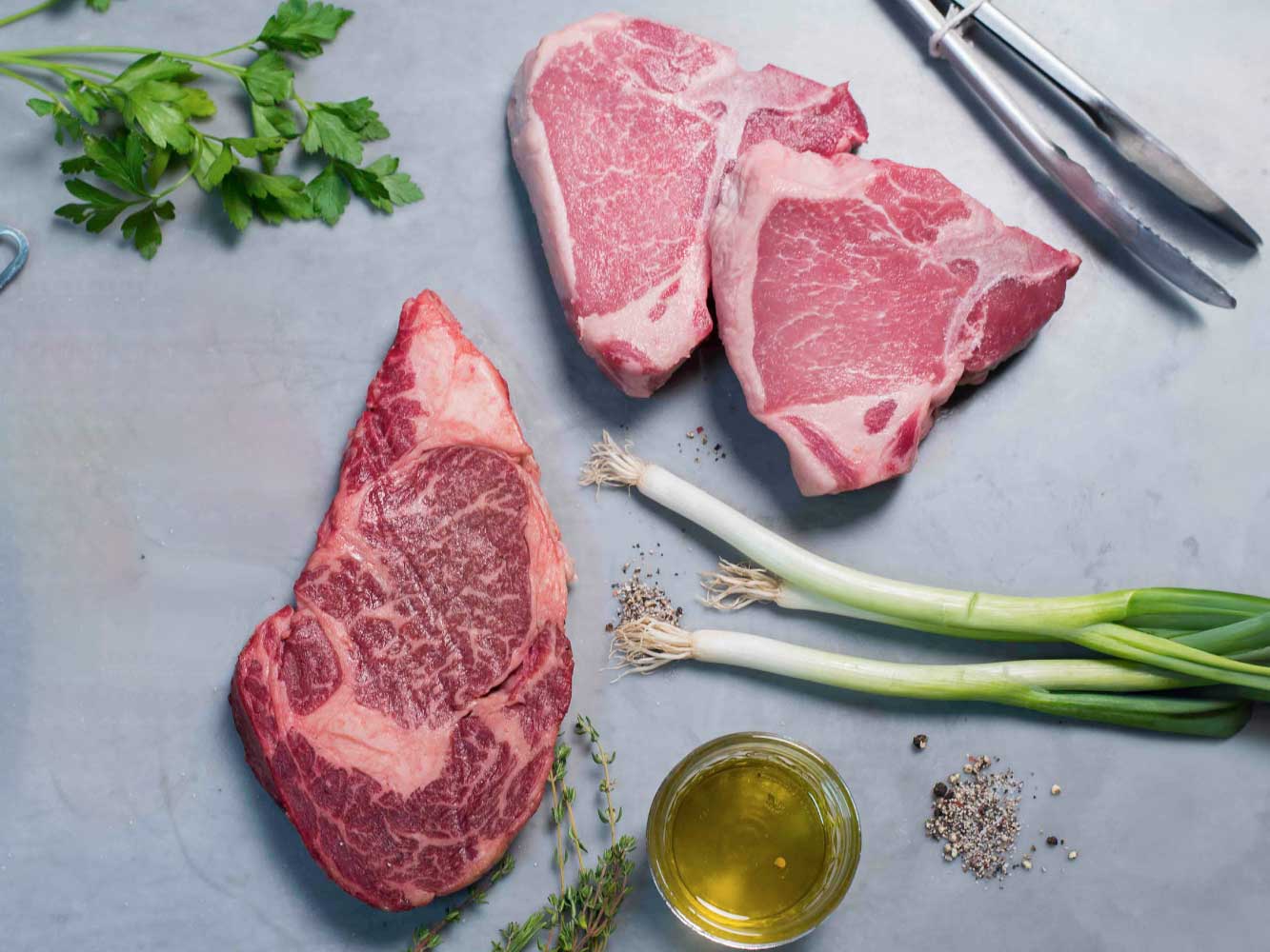WAGYU RIBEYE STEAK AND HERITAGE PORK CHOPS