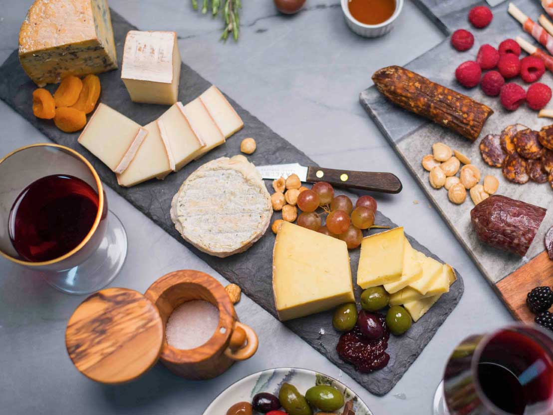 Meat and Cheese Board with Olives, Fruit, and Nuts